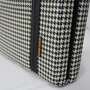 Close up of KONA CAVE® designer portable travel dog bed in black and white houndstooth fabric. Machine washable folded restaurant dog bed. 