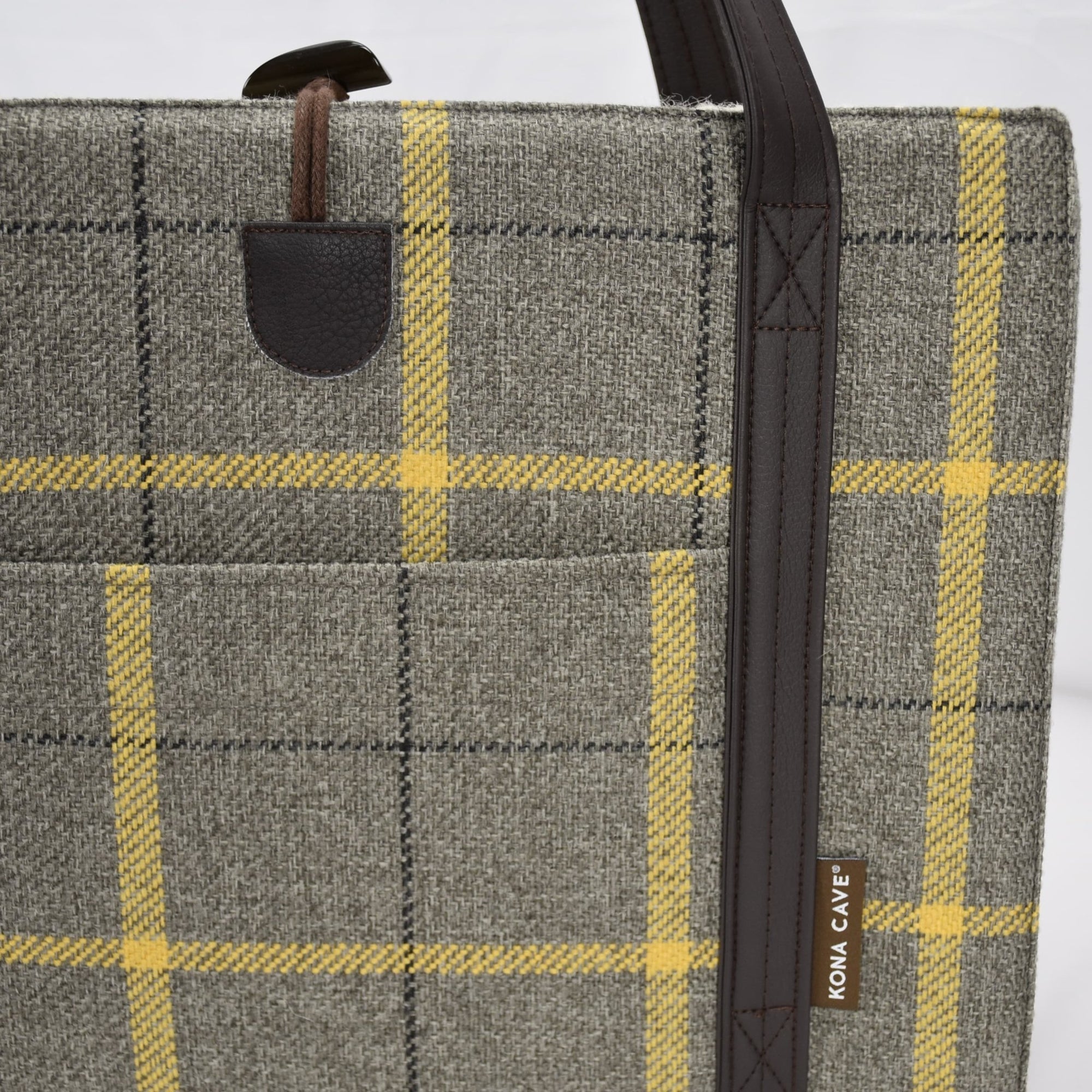 Close up of front pocket of grey and gold country plaid travel dog restaurant bed by KONA CAVE®