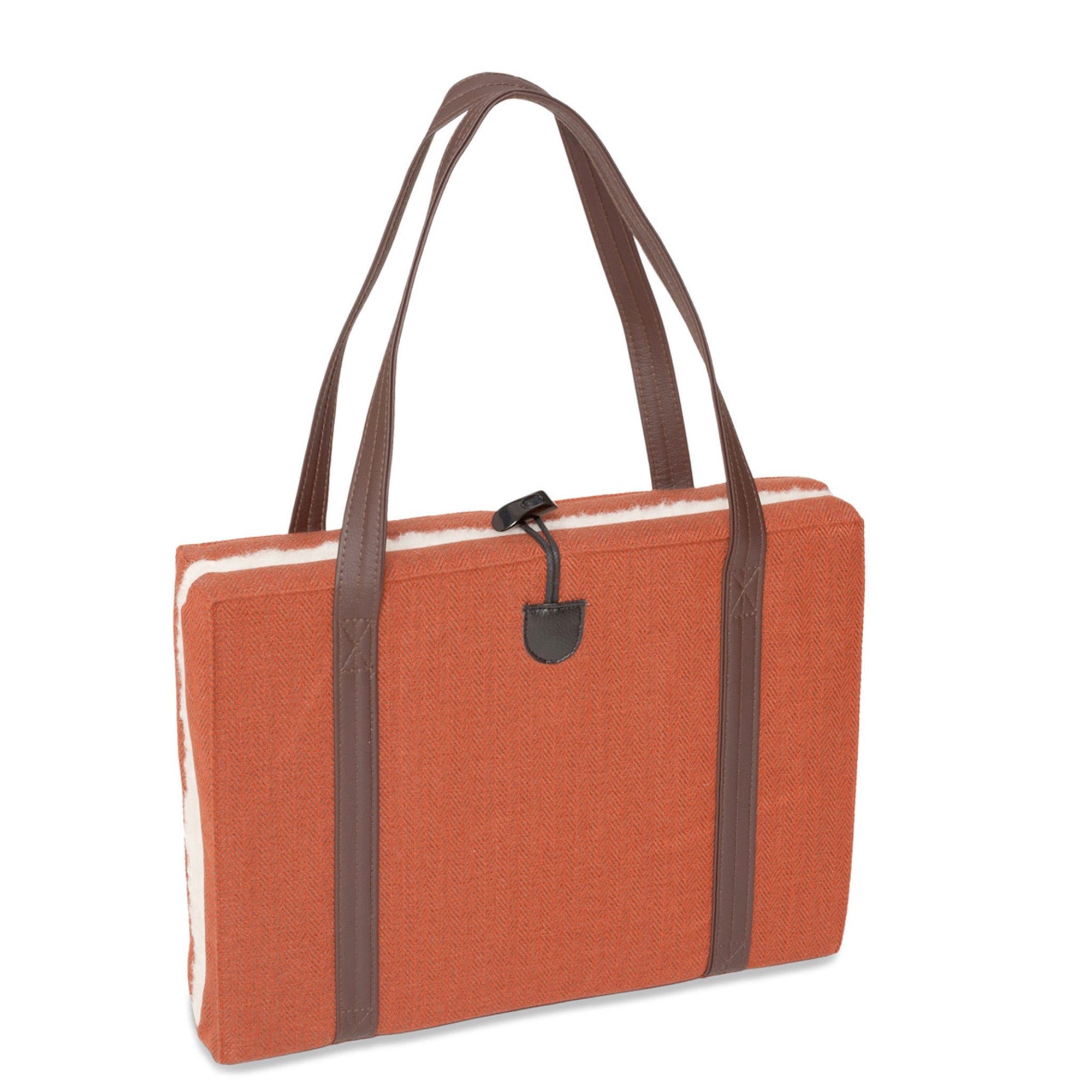 Luxury flooded KONA CAVE® dog mat used as a seat cushion for arenas. Folded  cushion with breathable lining and long shoulder straps for easy transportation. 