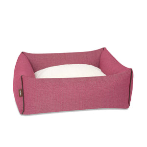 KONA CAVE® designer bolster dog bed in elegant pink herringbone fabric with leather trim. 
